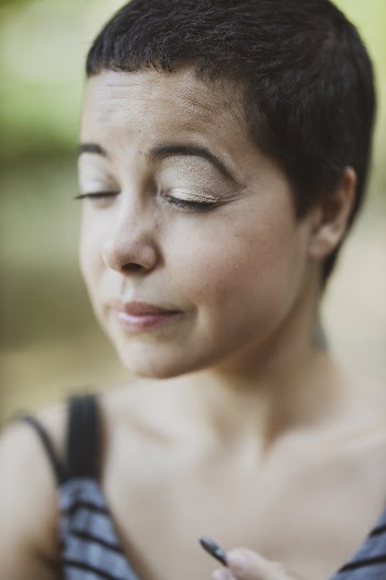 Woman in Gray Tank Top Closing Her Eyes