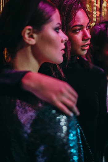 Woman in Gray Top Beside Woman in Black Top