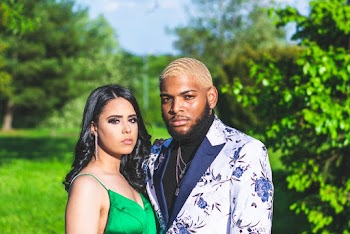 Woman In Green Dress And Man In Floral Suit