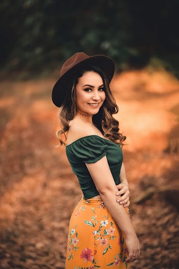 Woman In  Green Off-shoulder Top and Floral Skirt