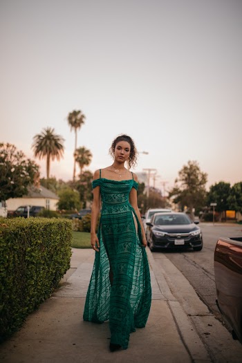 Woman in Green Spaghetti Strap Maxi Dress Walking Outdoors