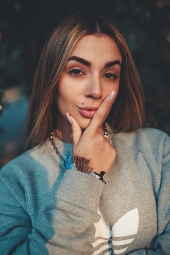 Woman In Grey Adidas Sweatshirt