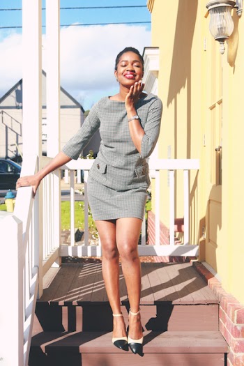 Woman In Grey Quarter Sleeved Blouse And Skirt