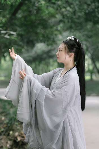 Woman In Grey Robe