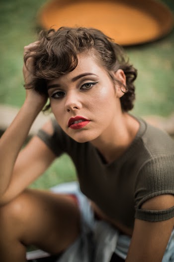 Woman in Grey Shirt With Red Lipstick Posing for Photography