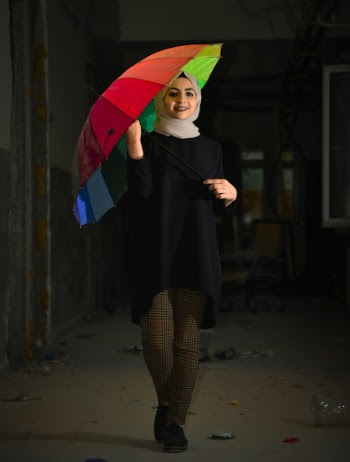 Woman in Hijab Headscarf Holding Umbrella