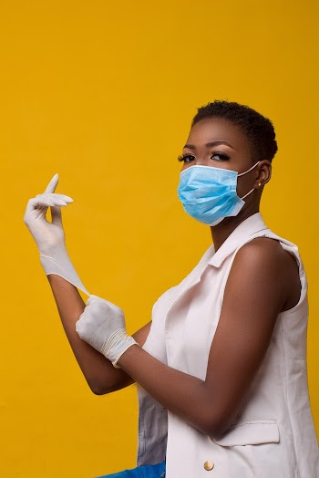 Woman in hospital mask and gloves