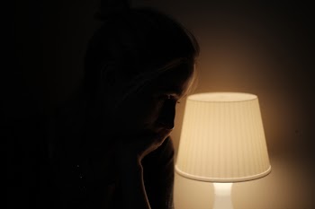 Woman in lamplight