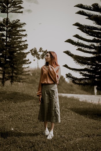 Woman In Long Sleeved Shirt And Skirt