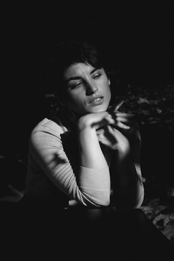 Woman in Long-sleeved Top Posing on Photo