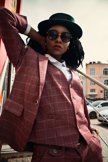 Woman in Maroon Buttoned Coat Wearing Black Hat