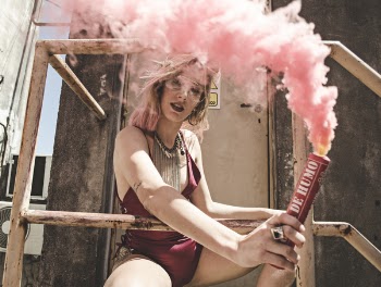 Woman in Maroon Monokini Holding Dynamite