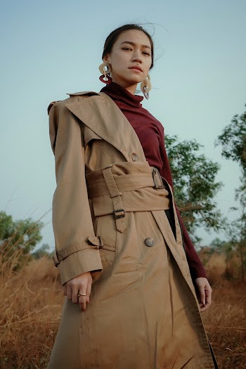 Woman In Maroon Turtleneck Top And Brown Trench Coat