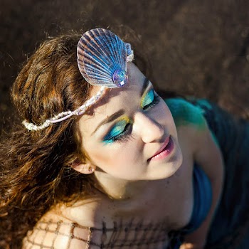 Woman in Mermaid Costume Posing for Photo