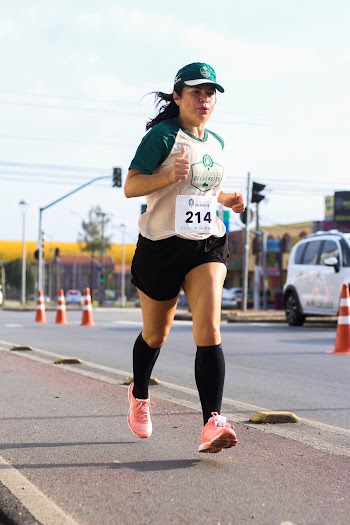 Woman in Number 214 Running on Road