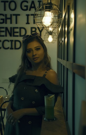 Woman in Off-shoulder Dress Leaning Near Drinking Glass