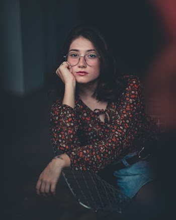 Woman in Orange and Brown Floral Shirt