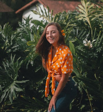 Woman In  Orange and White Polka-dot Top