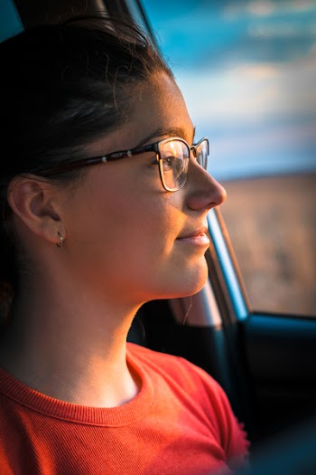 Woman in Orange Crew-neck Top Near Car Door