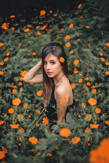 Woman in Orange Flower Field