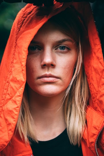 Woman In Orange Hoodie Close-up Photography