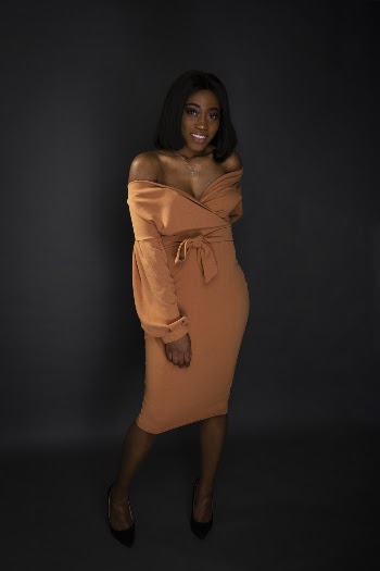 Woman In Orange Off-Shoulder Dress