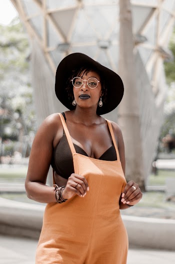 Woman in Orange Overalls
