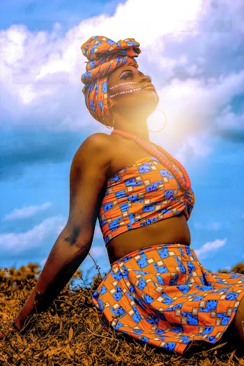 Woman In Orange Printed Wear