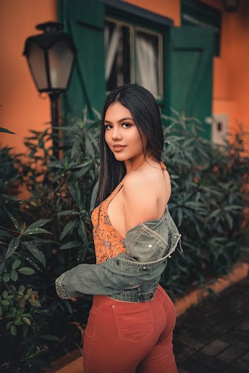 Woman In Orange Sleeveless Top