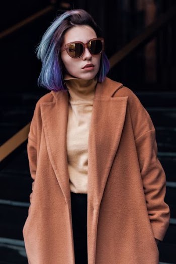 woman in pink coat standing