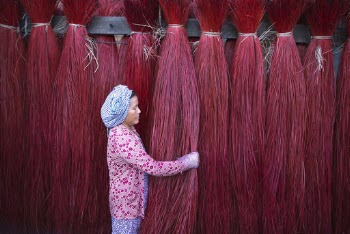 Woman in Pink Long Sleeved Shirt Holding Red Ropes