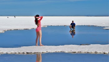 Woman in Pink Long-sleeved Swimsuit on Island