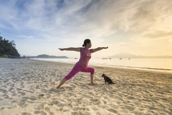 Woman In Pink Shirt Posing While Standing On Shore