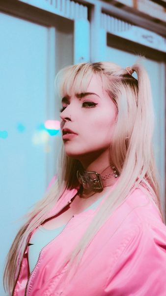 woman in pink top with pigtails