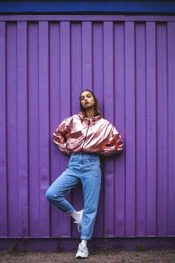 Woman In Pink Zip-up Jacket And Blue Denim Jeans