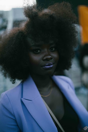 Woman in Purple Peaked Lapel Suit Jacket