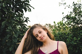 Woman in Purple Spaghetti Strap Top