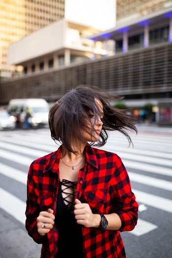 Woman In Red And Black Checked Top