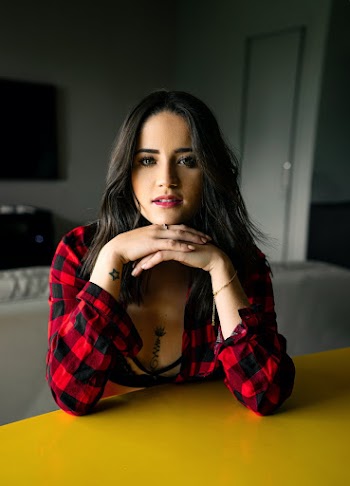 Woman In Red And Black Checked Top