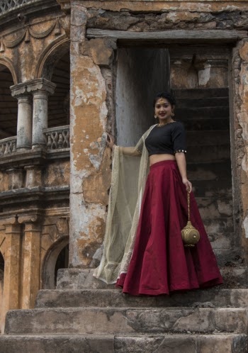 Woman In Red And Black Dress Posing For A Photo