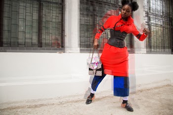 Woman in Red and Multicolored Shirt Dress Holding Bag