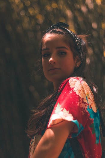 Woman in Red and Pink Floral Top