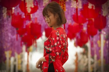 Woman in Red and White Floral Cheonsam Smiling