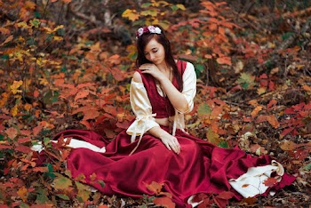 Woman in Red and White Long-sleeved Crop Top and Skirt