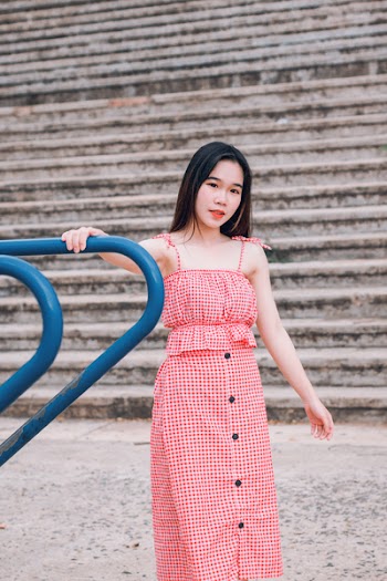 Woman in Red and White Spaghetti Strap Dress