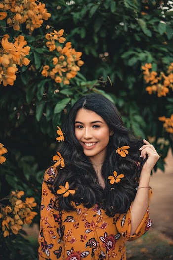Woman in Red and Yellow Floral Button-up Long-sleeved Dress