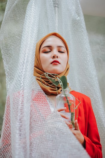 Woman in Red Blazer And Brown Hijab