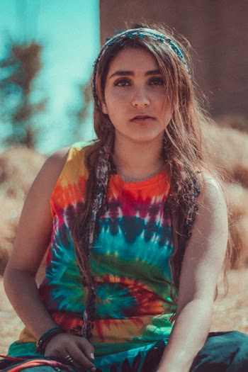 Woman in Red, Blue, and Orange Tie Dye Tank Top Macro Shot