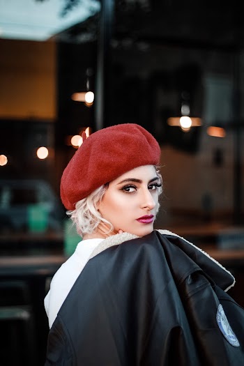 Woman in Red Cap and Black Top