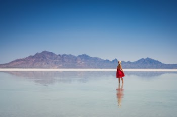 Woman In Red Dress Near Mountain